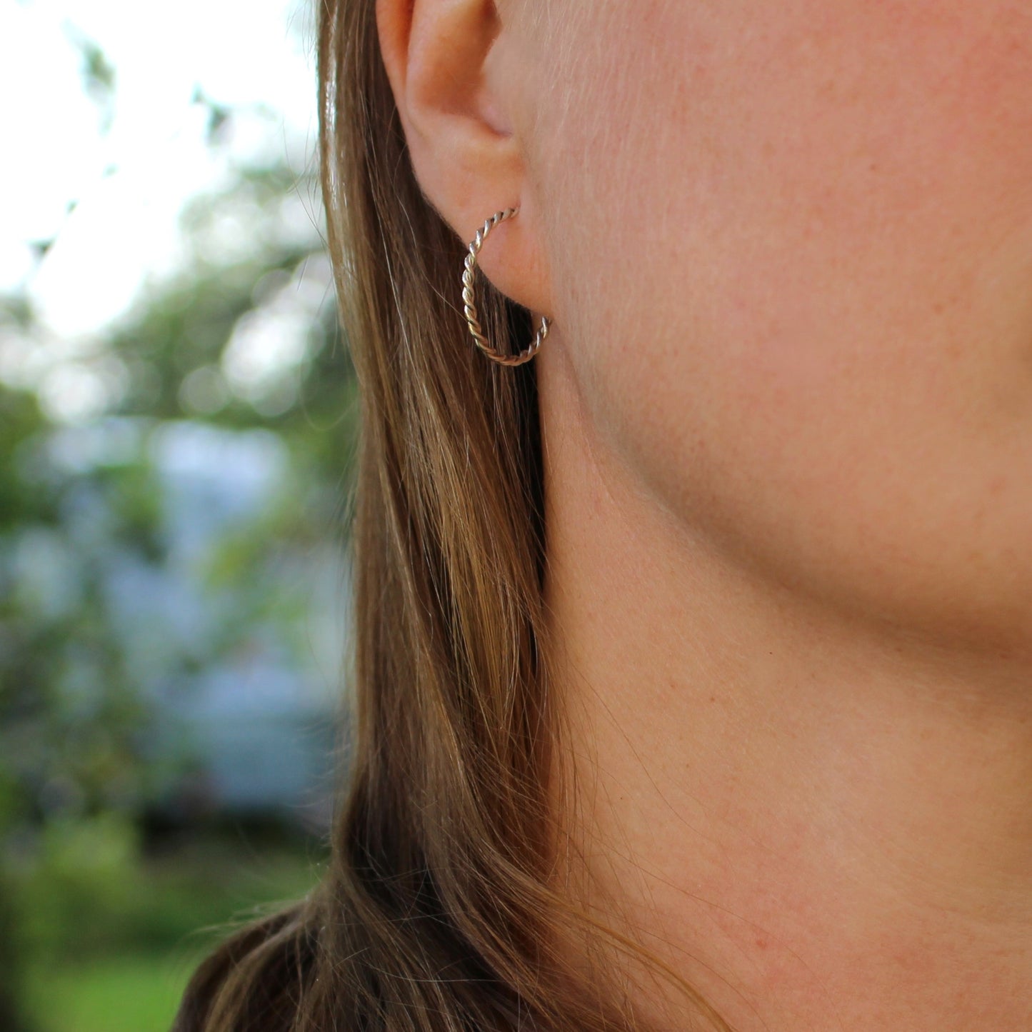 filigree earrings on ear