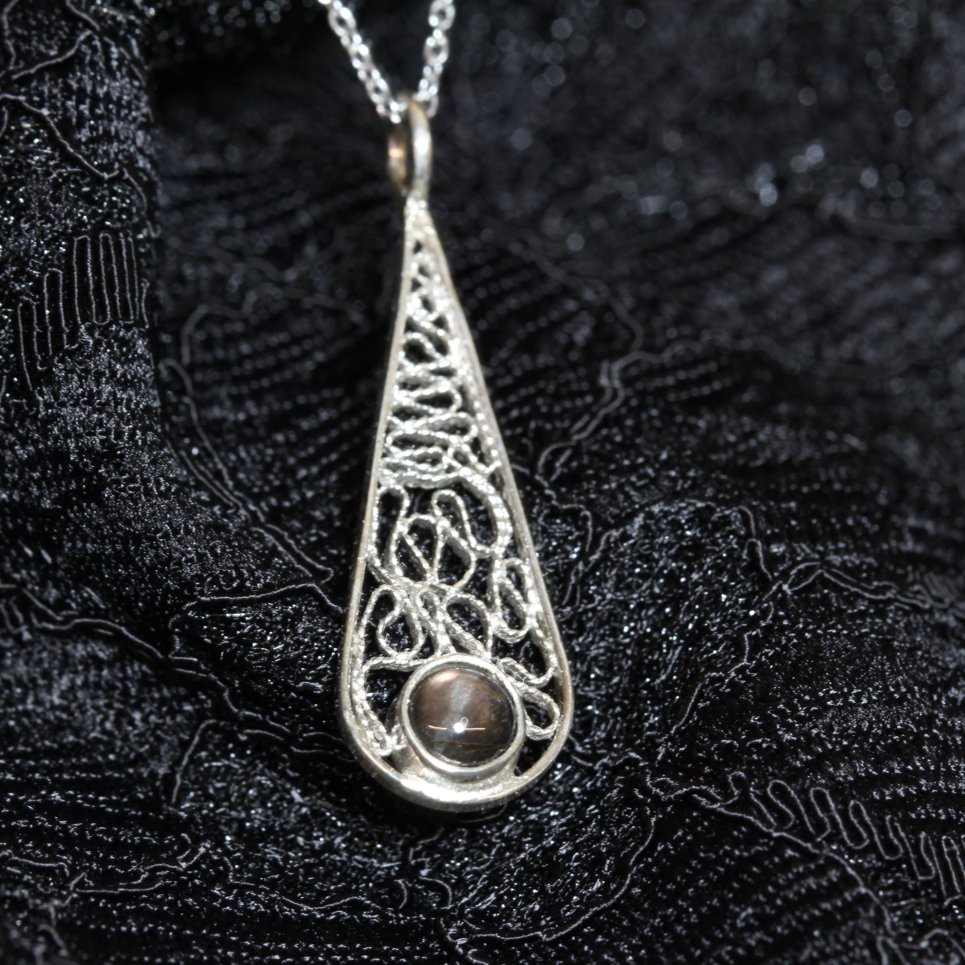 silver filigree pendant with spectrolite