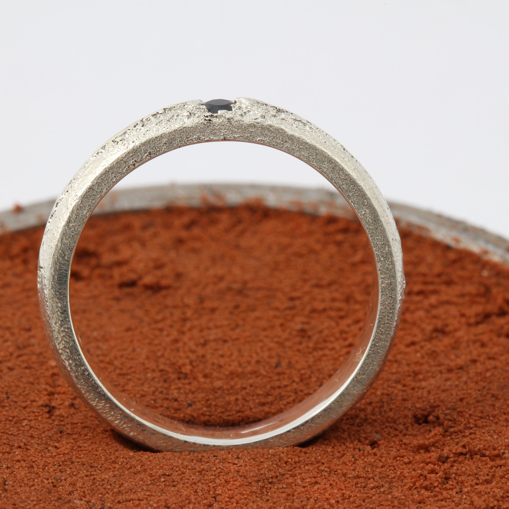 silver ring with blue sapphire side