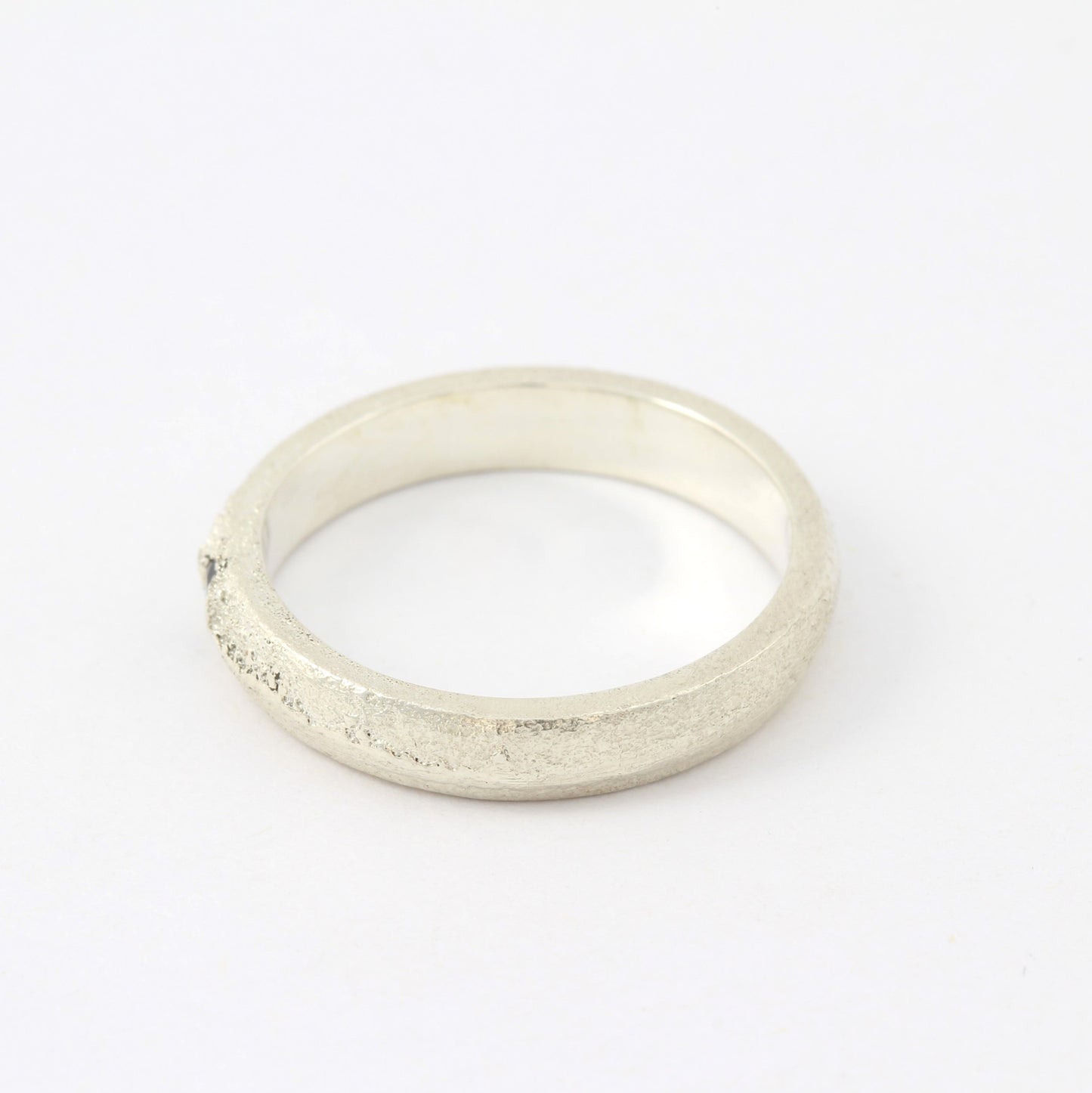 silver ring with blue sapphire left