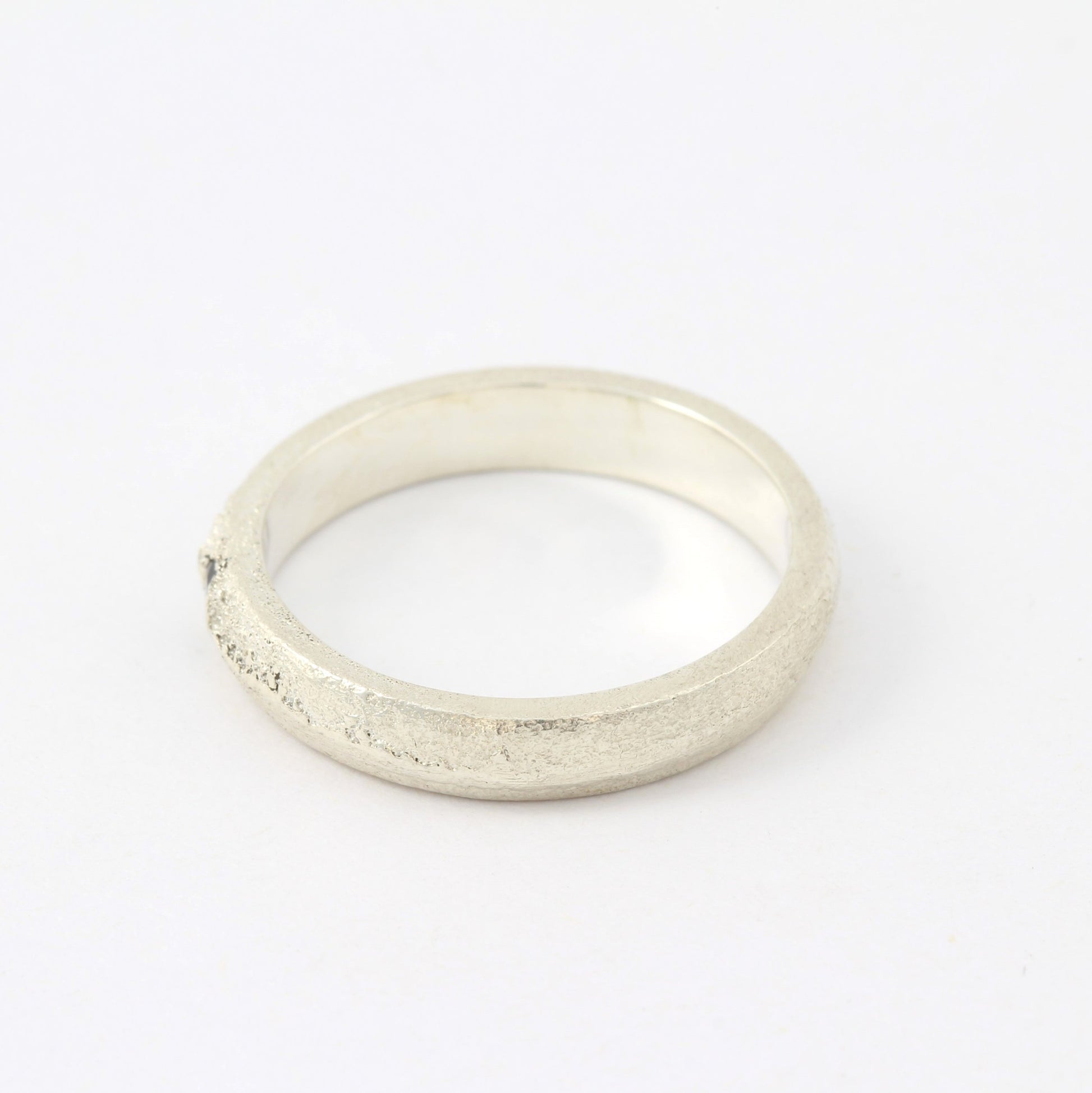 silver ring with blue sapphire left