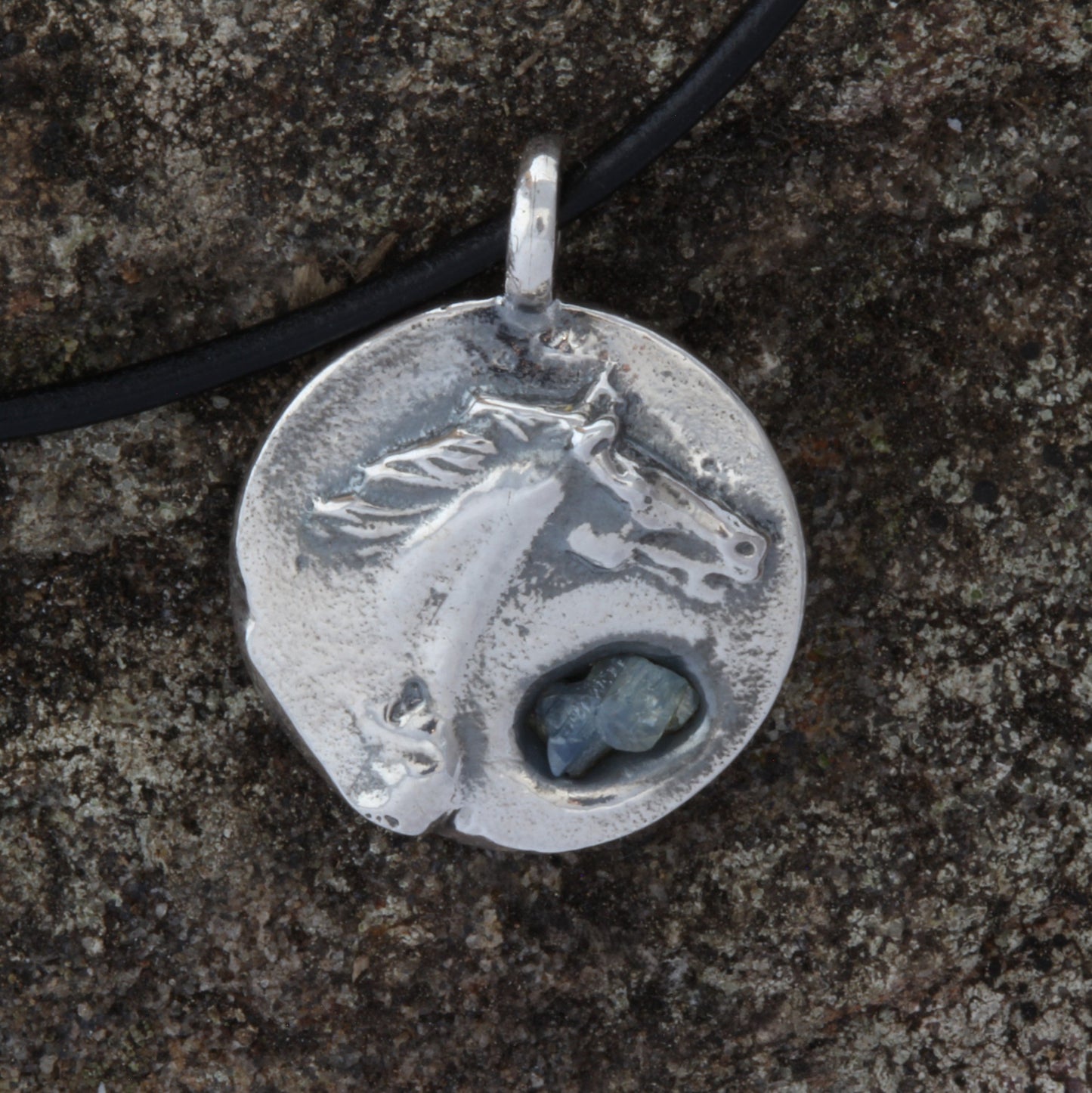 horse silver pendant with rough sapphire front
