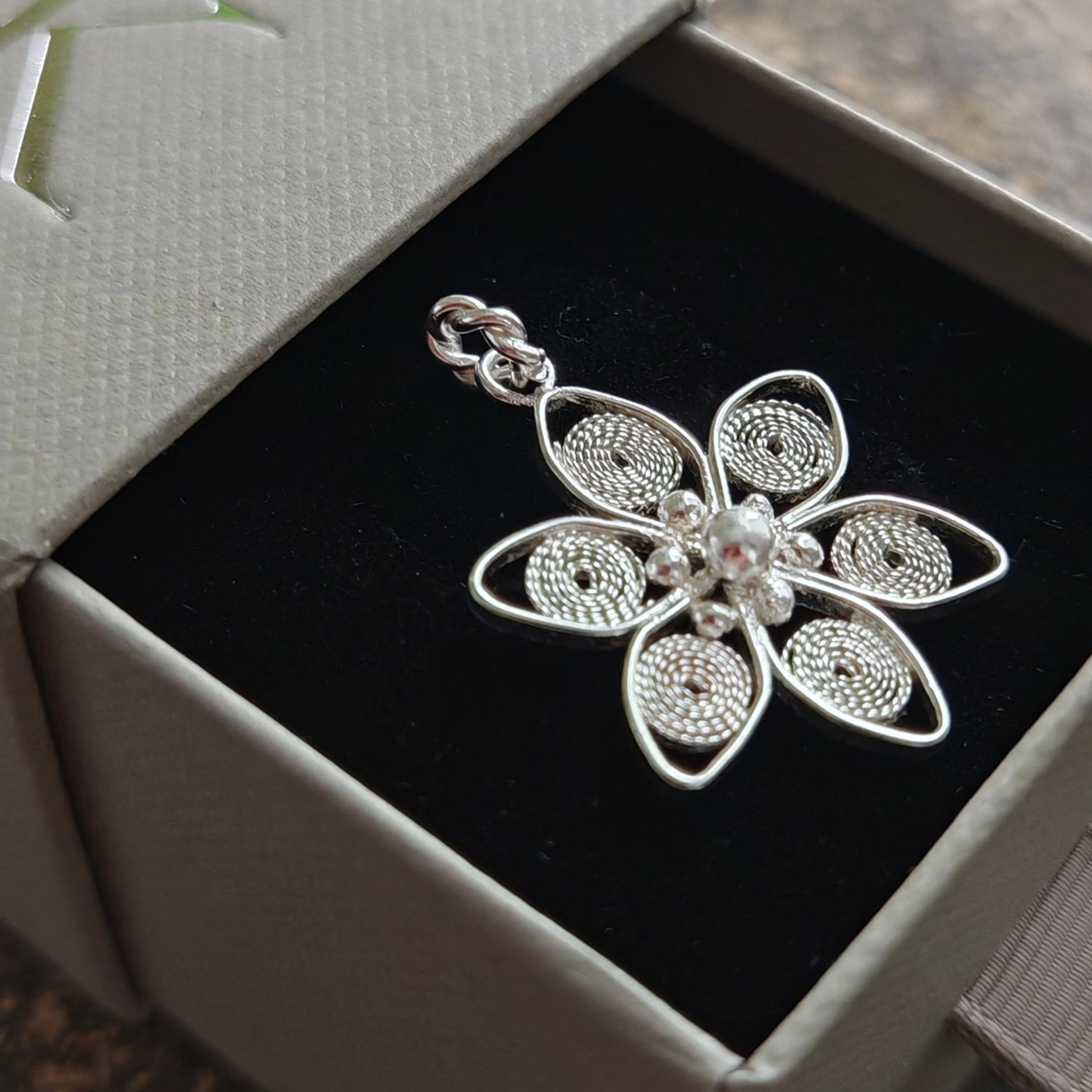 silver filigree anemone nemorosa pendant in box left side