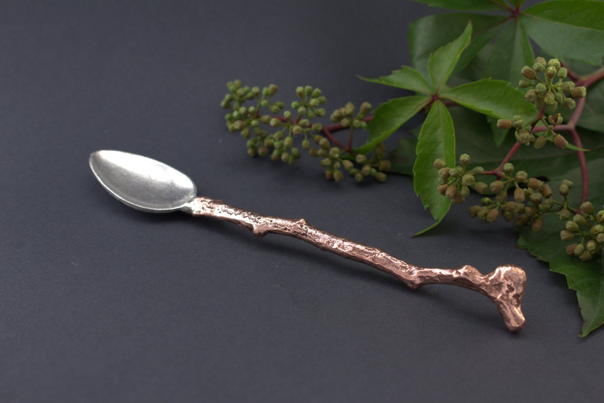 silver spoon with copper handle